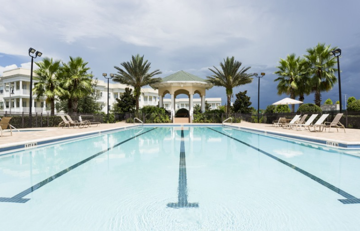 Resort lap pool with marked swim lanes and a shaded gazebo