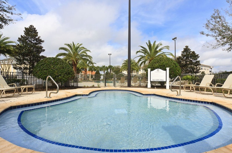 Quiet free-form community pool with loungers just minutes from the villa