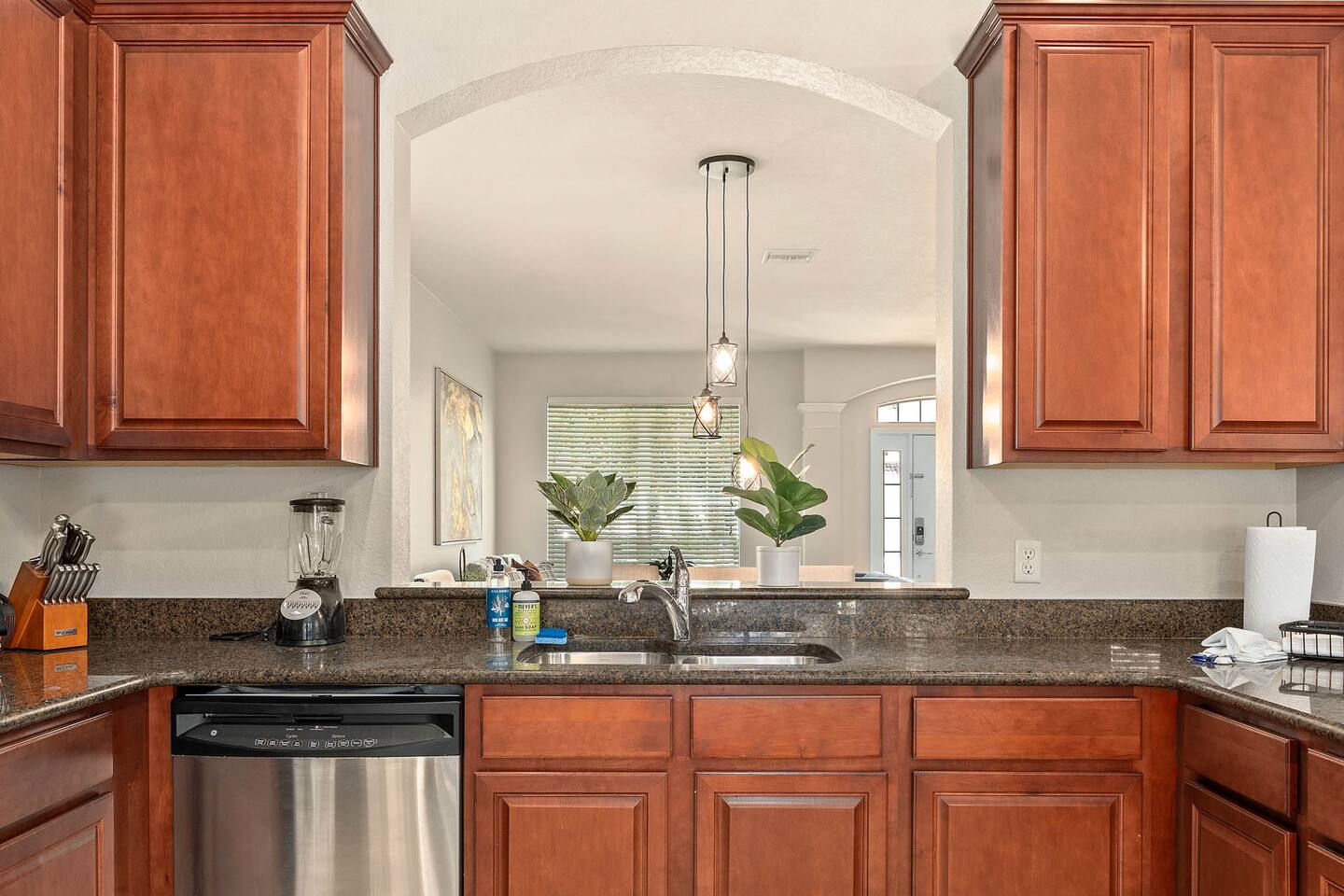 Enjoy culinary delights in a style with sleek appliances & natural light!