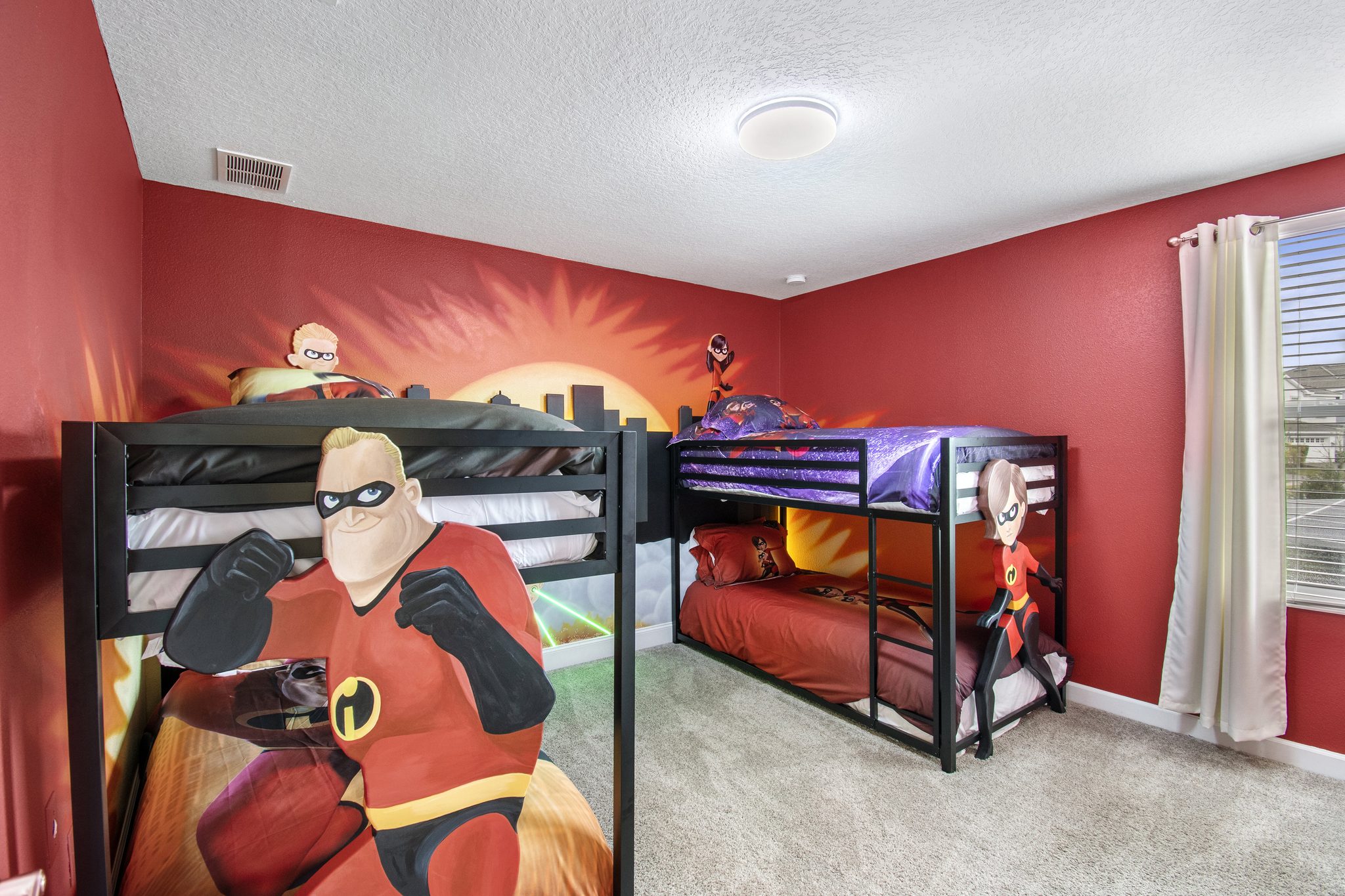 The Incredibles-themed bedroom showing both twin-over-twin bunk beds