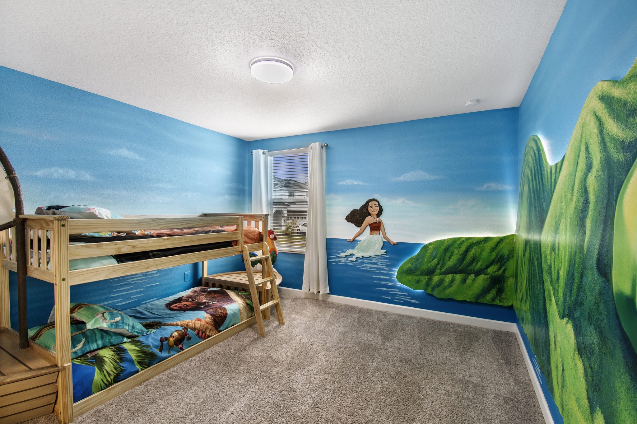 Moana-themed bedroom with a boat-shaped bunk bed and rooster figure