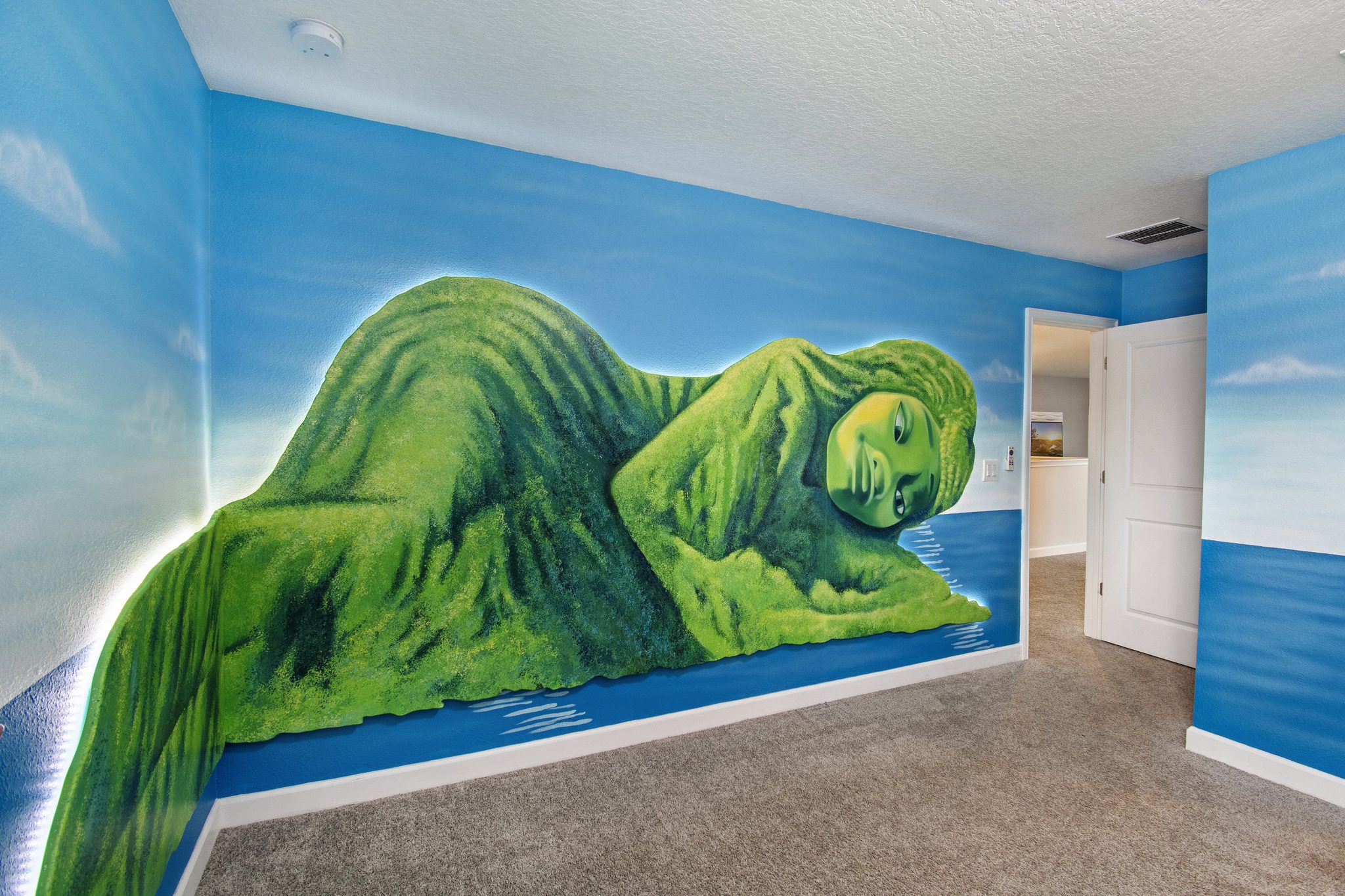 Moana-themed bedroom with a Te Fiti island wall mural