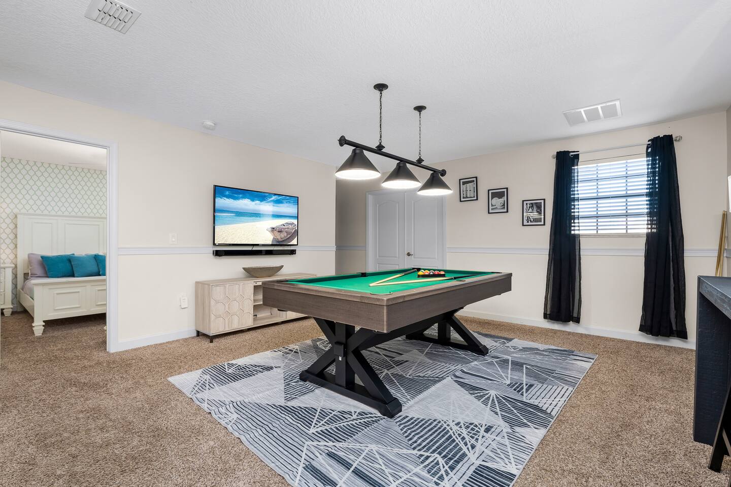 Challenge friends to a pool match in this stylish space with a big-screen TV!