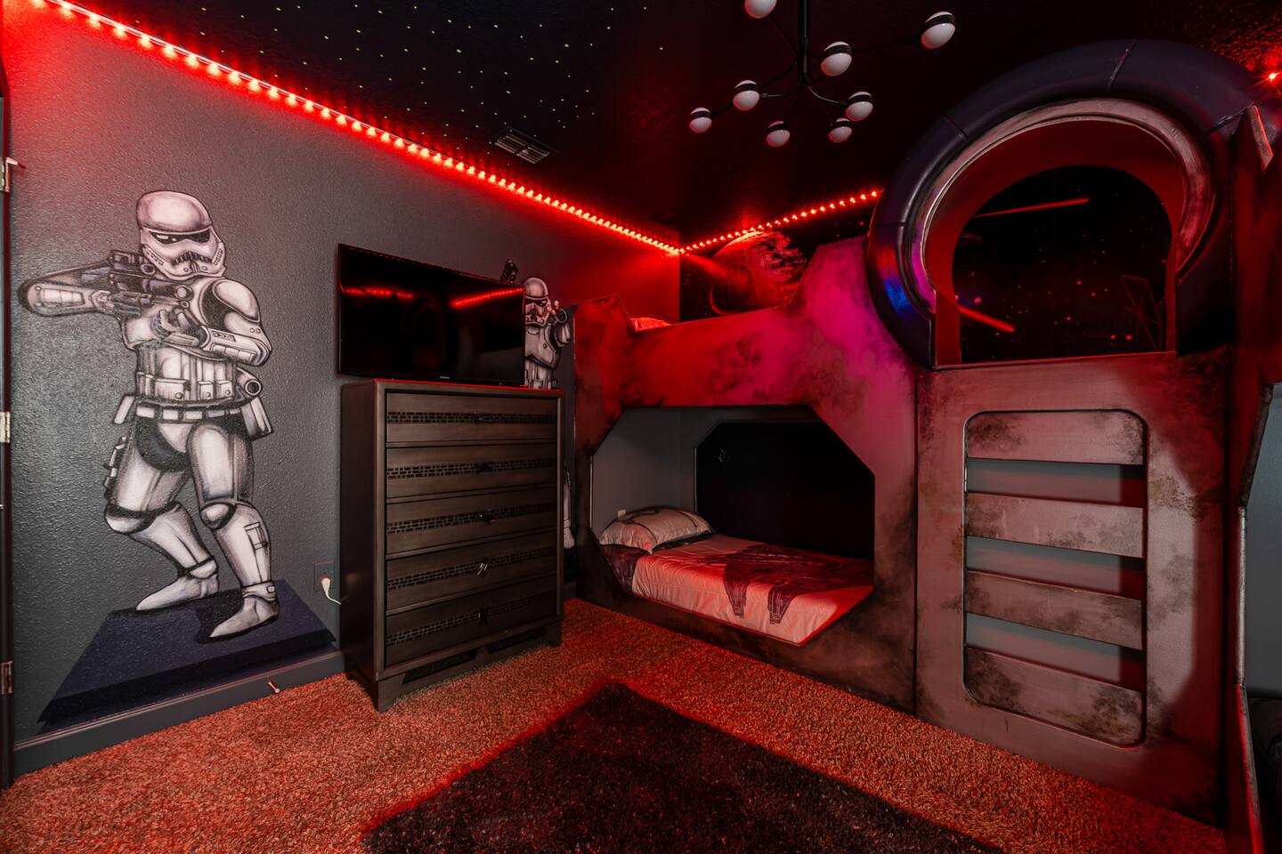 Galactic Bunker: Step into an epic themed room with vibrant lights and fun decor