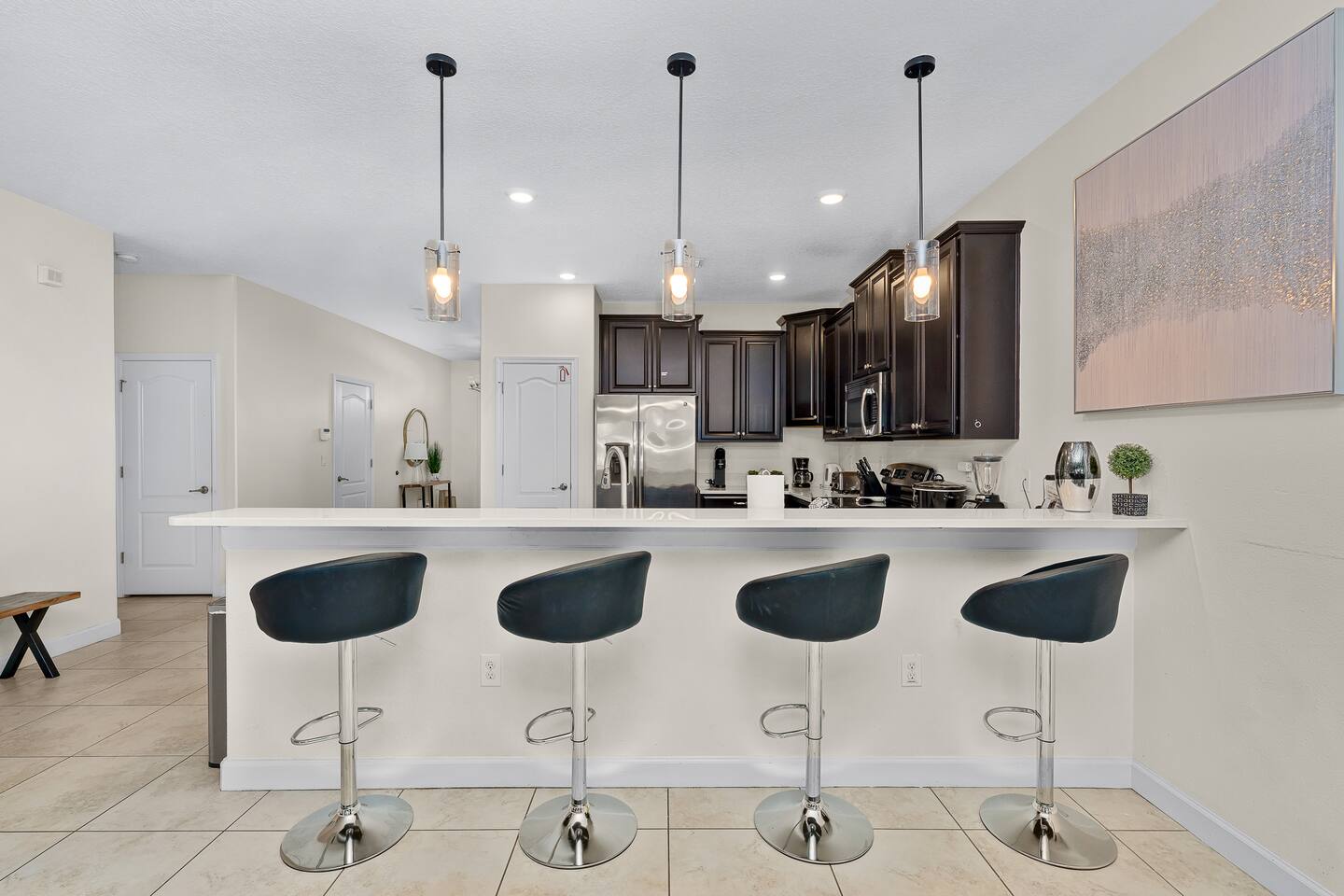 Modern vibes await with sleek bar seating and stylish lighting!