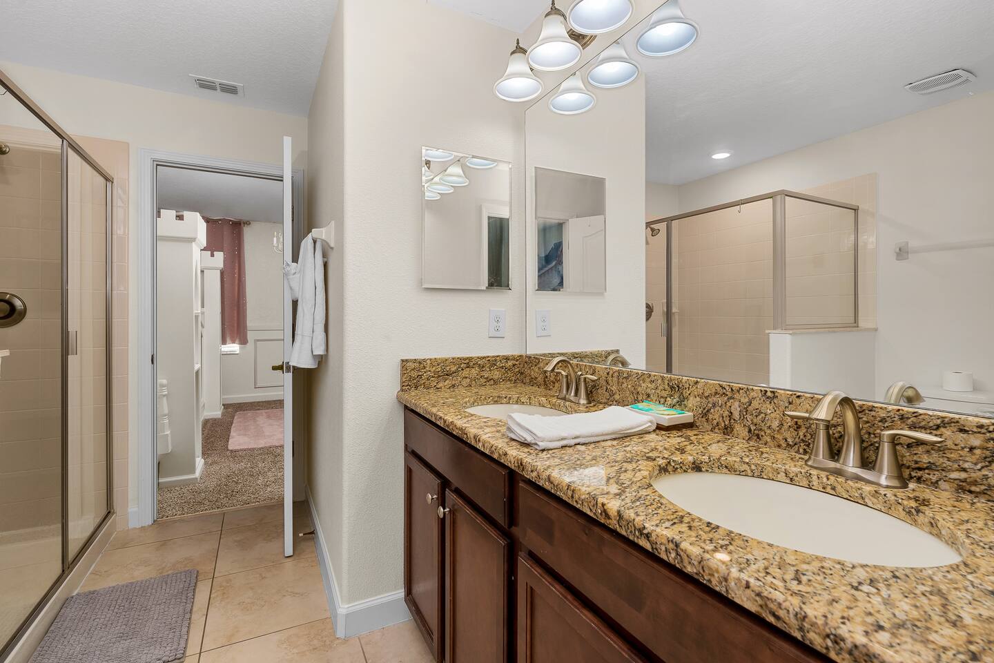 Experience a spacious double vanity and a modern walk-in shower!