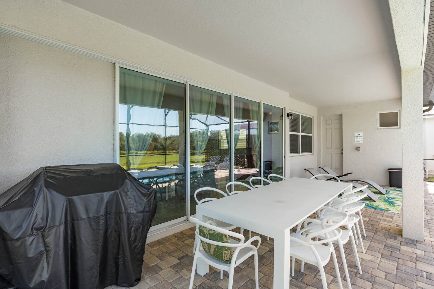 Grill and outdoor dining area by the pool makes for a great family fun day!