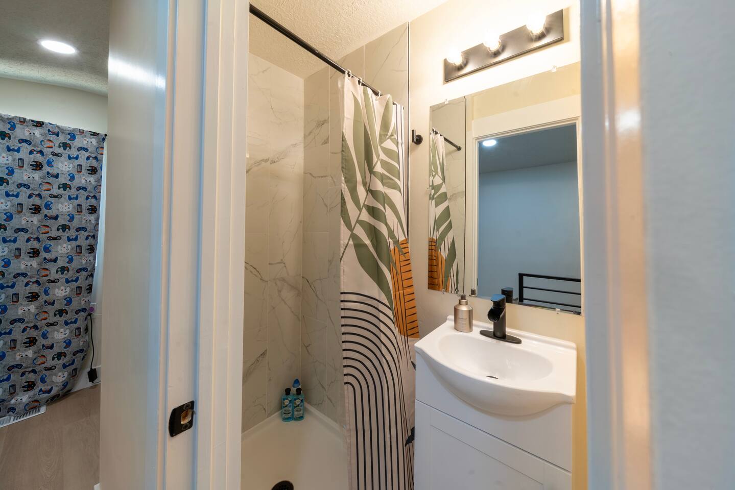 Second full bathroom, with shower, sink, toilet.